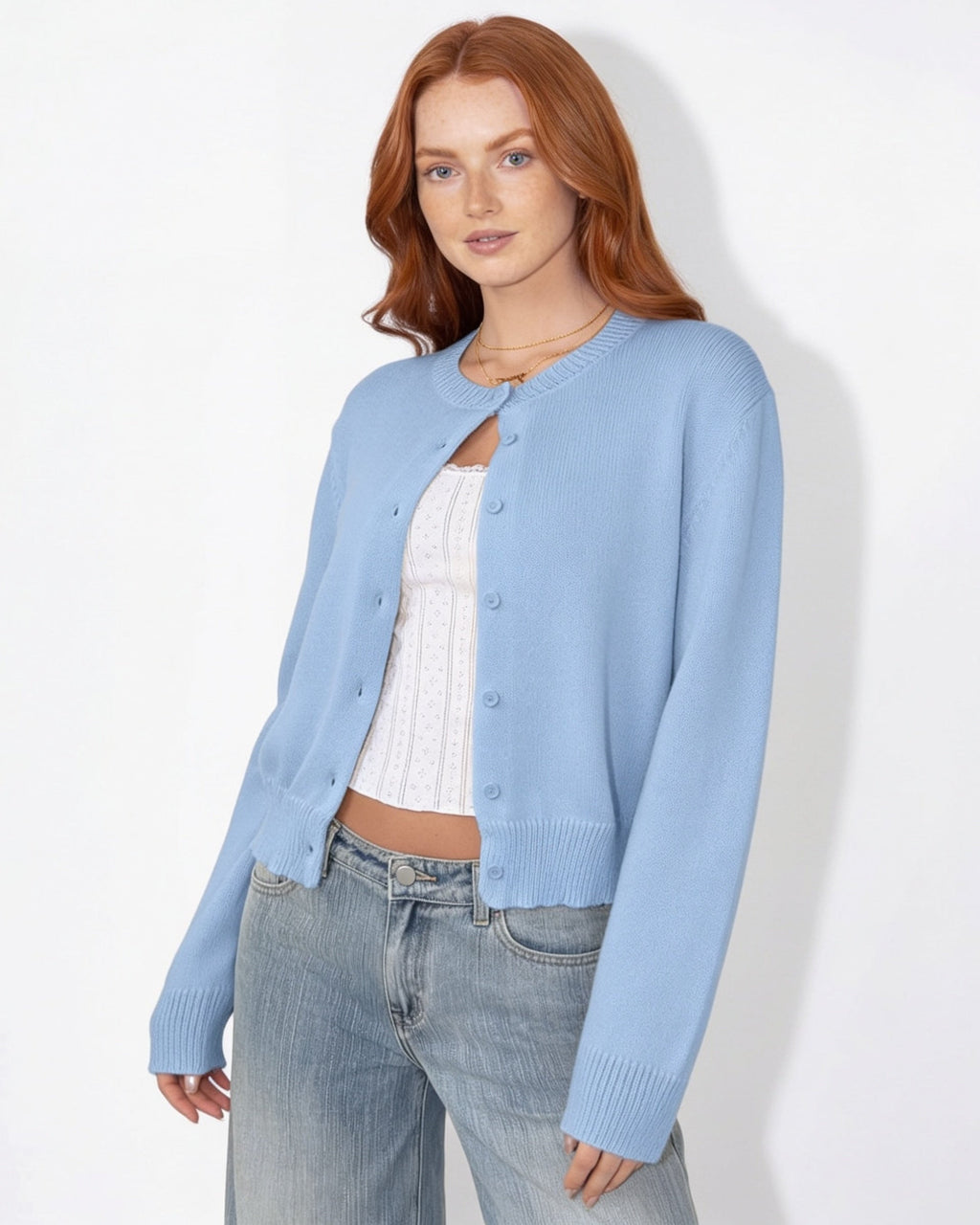 Light blue cropped button-front knit cardigan with round neck and long sleeves