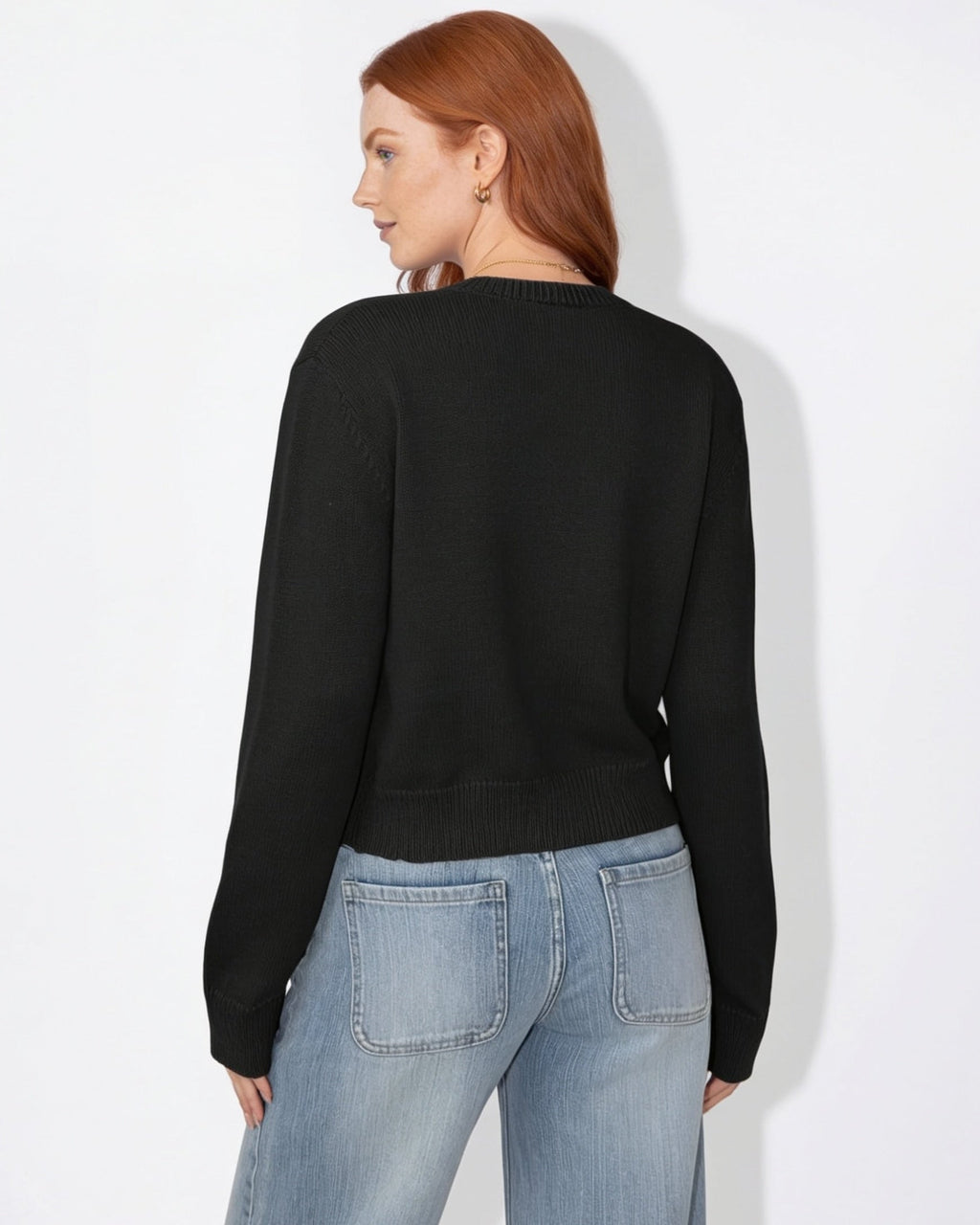 Black cropped knit cardigan with round neck and button-front, long sleeves