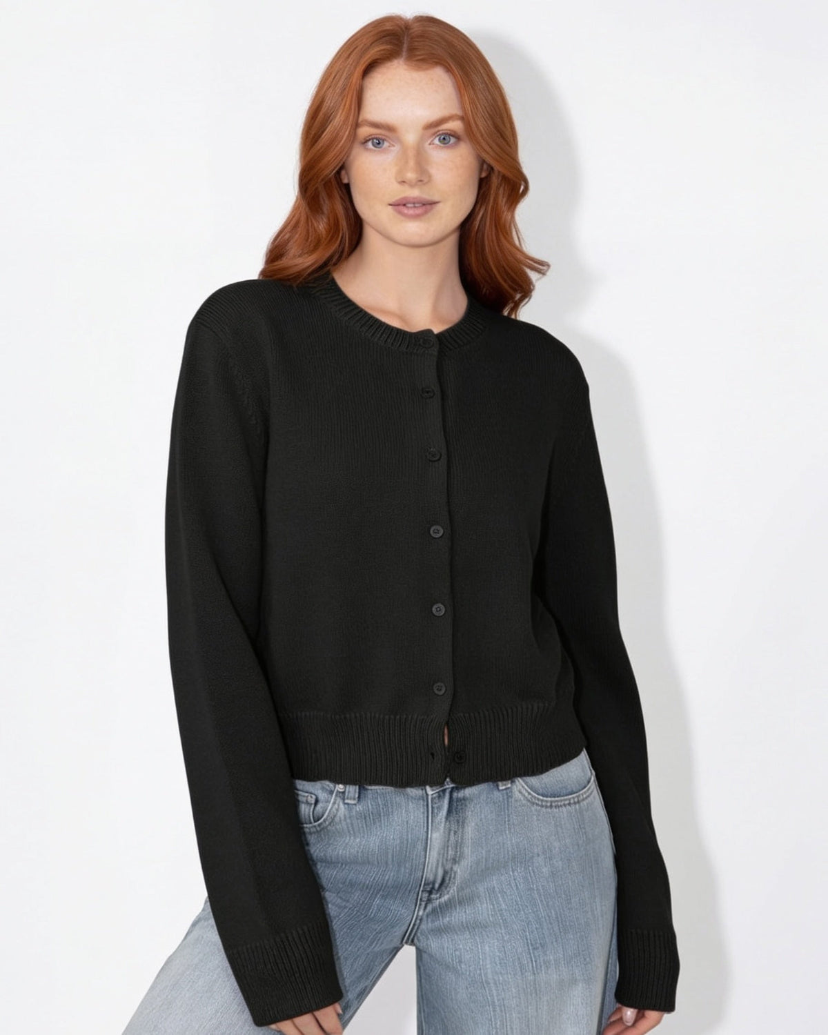 Black cropped knit cardigan with round neck and button front, long sleeves