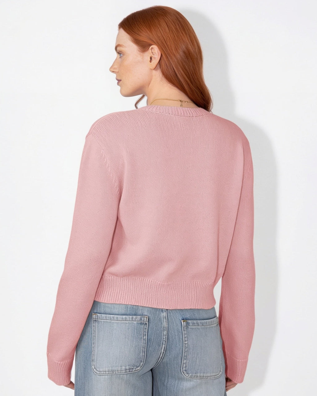 Pink cropped knit cardigan with round neck and button-front, ribbed cuffs (back)