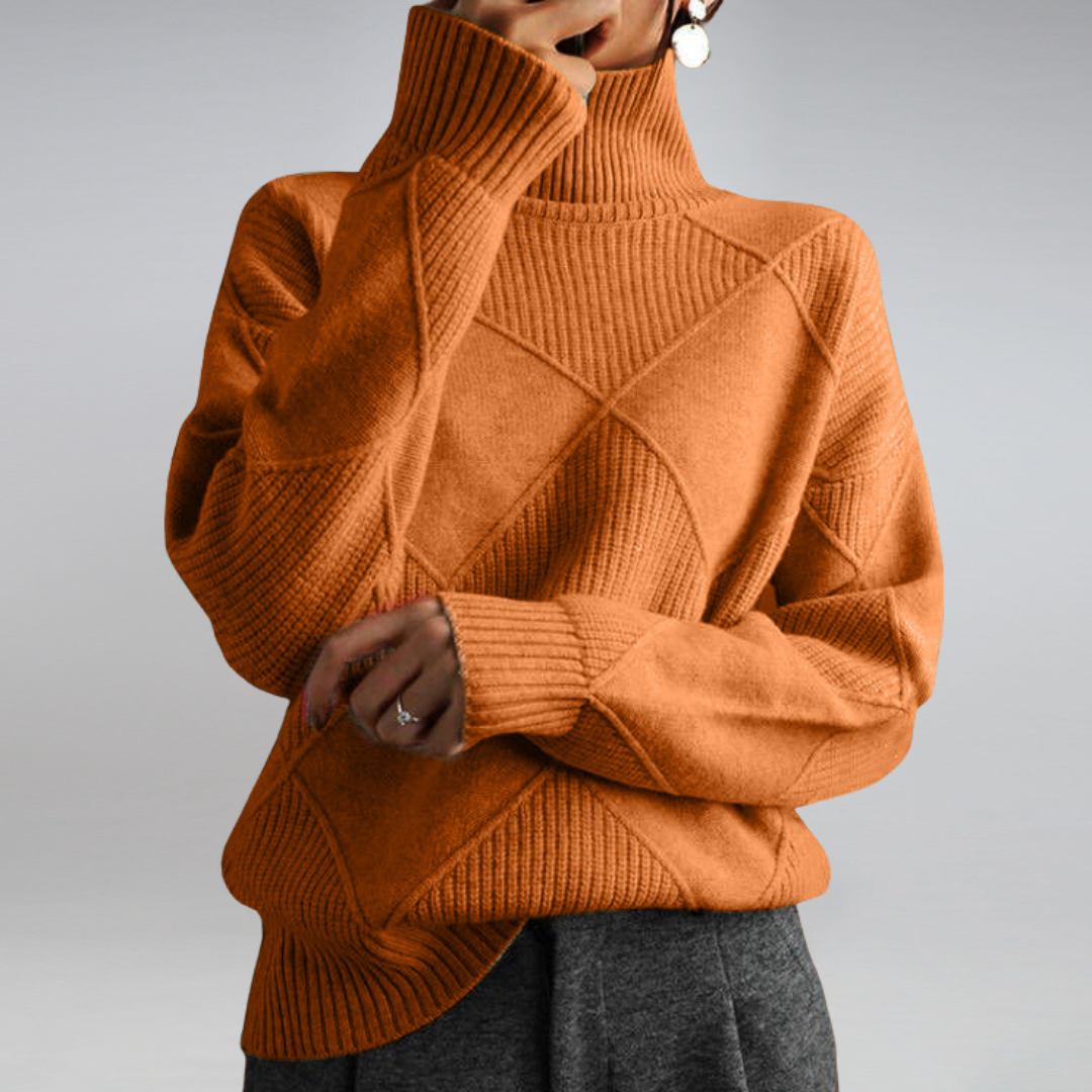 Women’s cashmere turtleneck sweater in burnt orange, diamond knit detail, ribbed turtleneck cuffs.