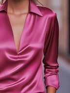 Fuchsia satin V-neck blouse with pointed collar and rolled cuffs