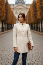 Women’s mid-length winter coat, cream, buttoned stand collar and long sleeves