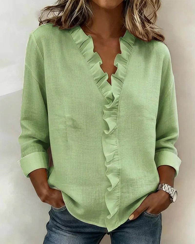 Green ruffle-trim V-neck blouse with long sleeves