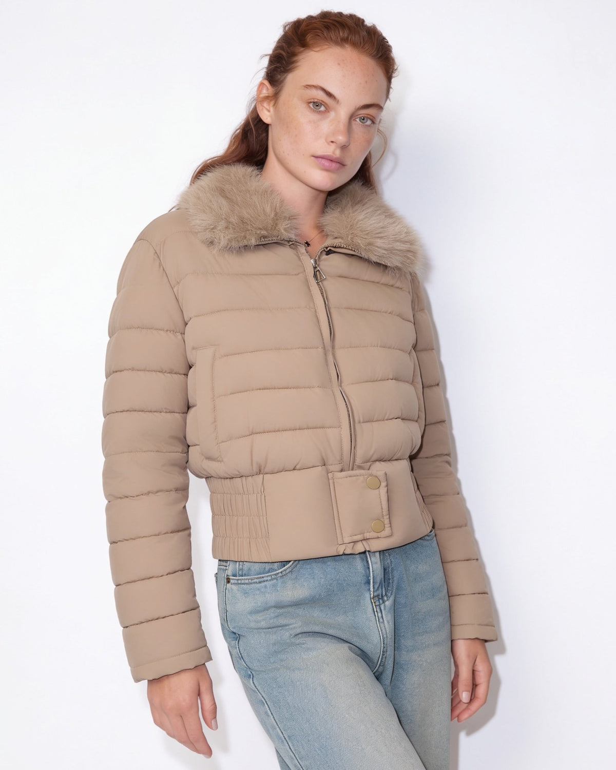 Beige cropped puffer jacket with faux fur collar, full front zipper, side buttons