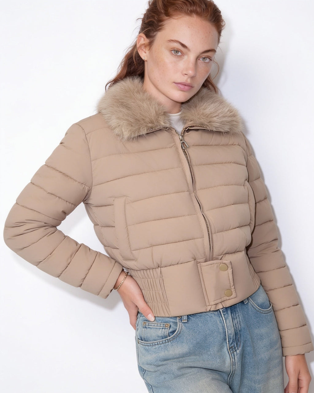 Beige cropped puffer jacket with faux fur collar, front zipper and snap pocket detail