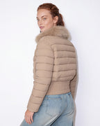 Beige cropped puffer jacket with faux fur collar, quilted panels, front zipper