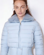 Light blue cropped puffer jacket with faux fur collar and front zipper, quilted baffles