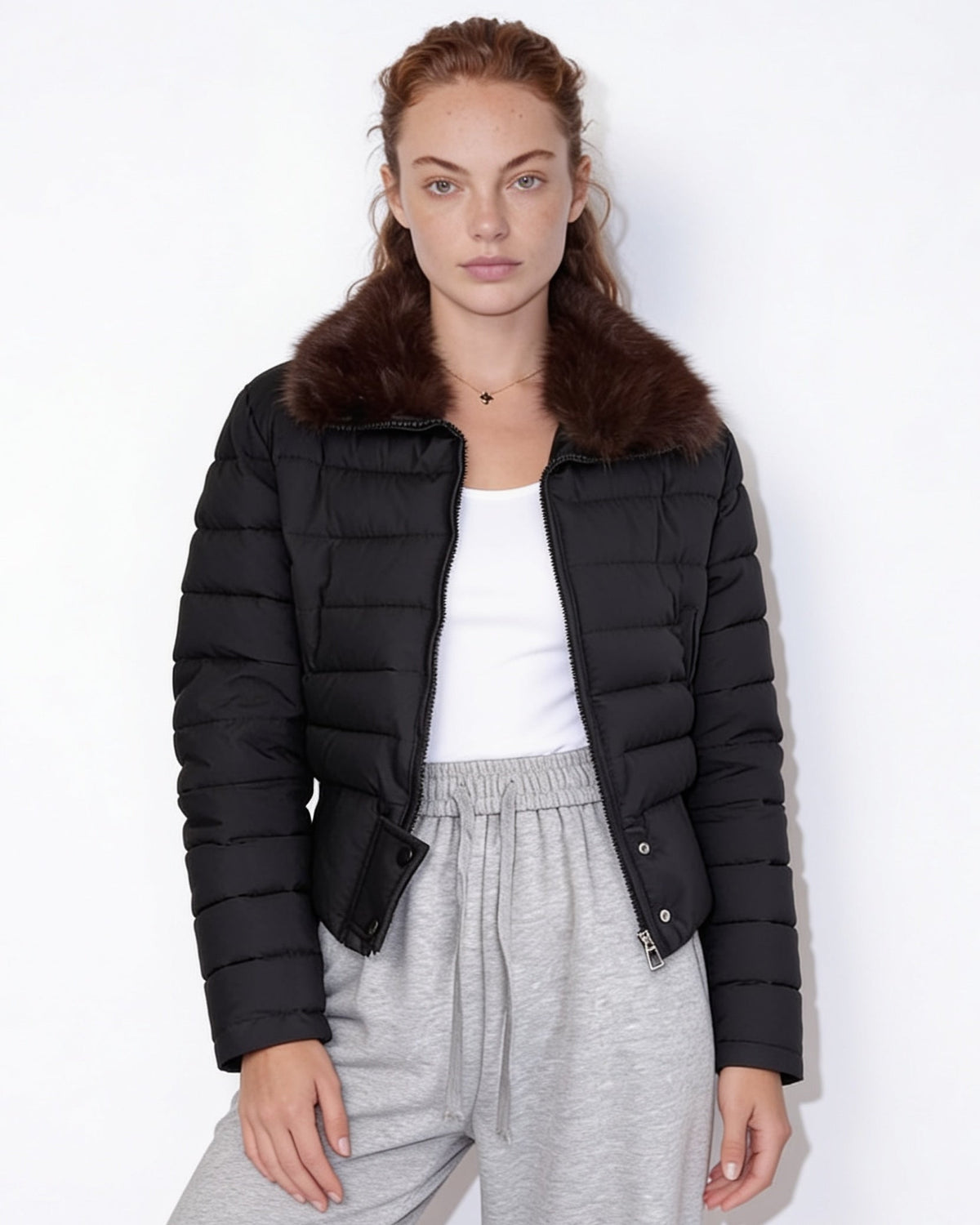 Black cropped puffer jacket with faux fur collar and zip front