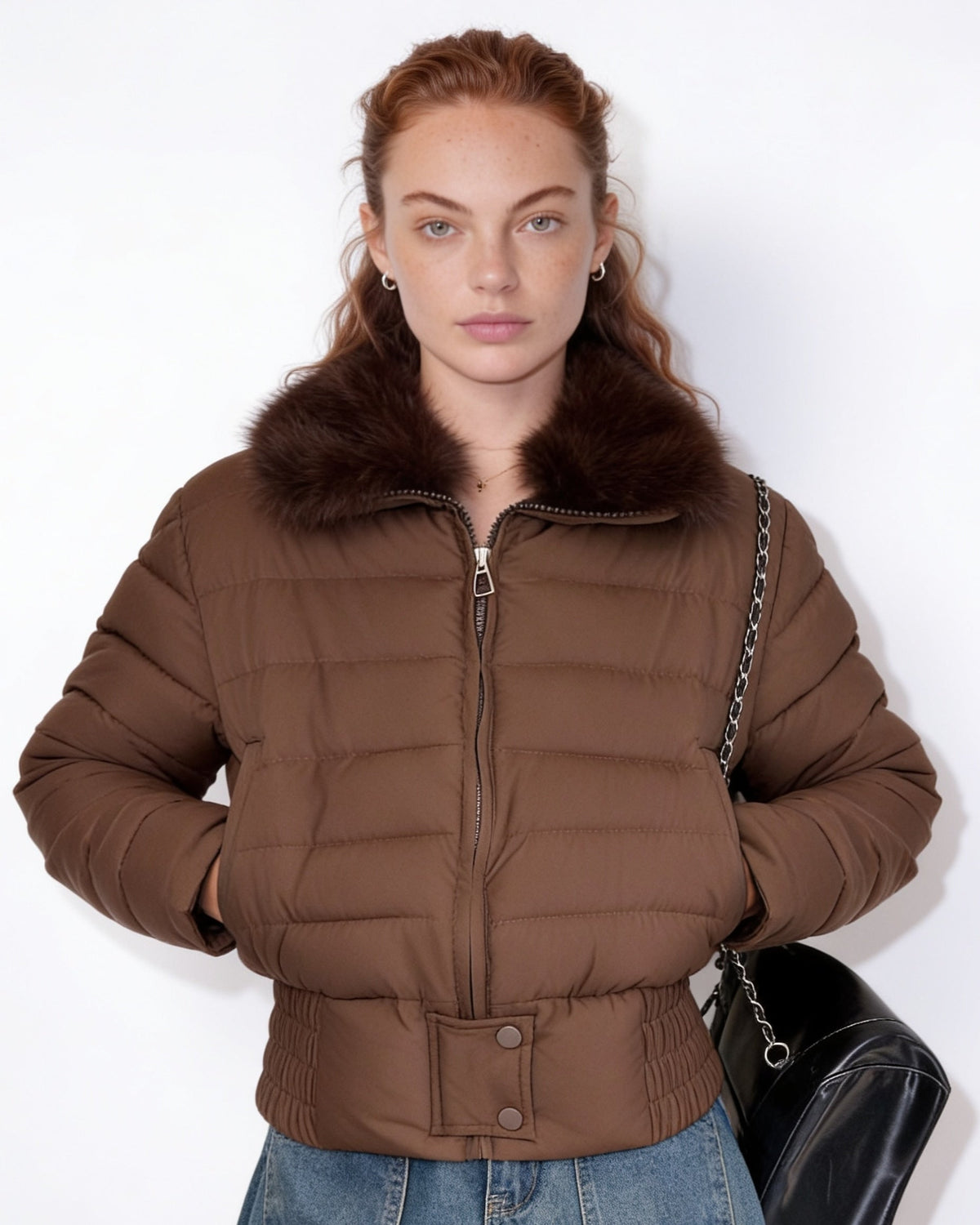 Brown cropped puffer jacket with dark faux fur collar and zip front