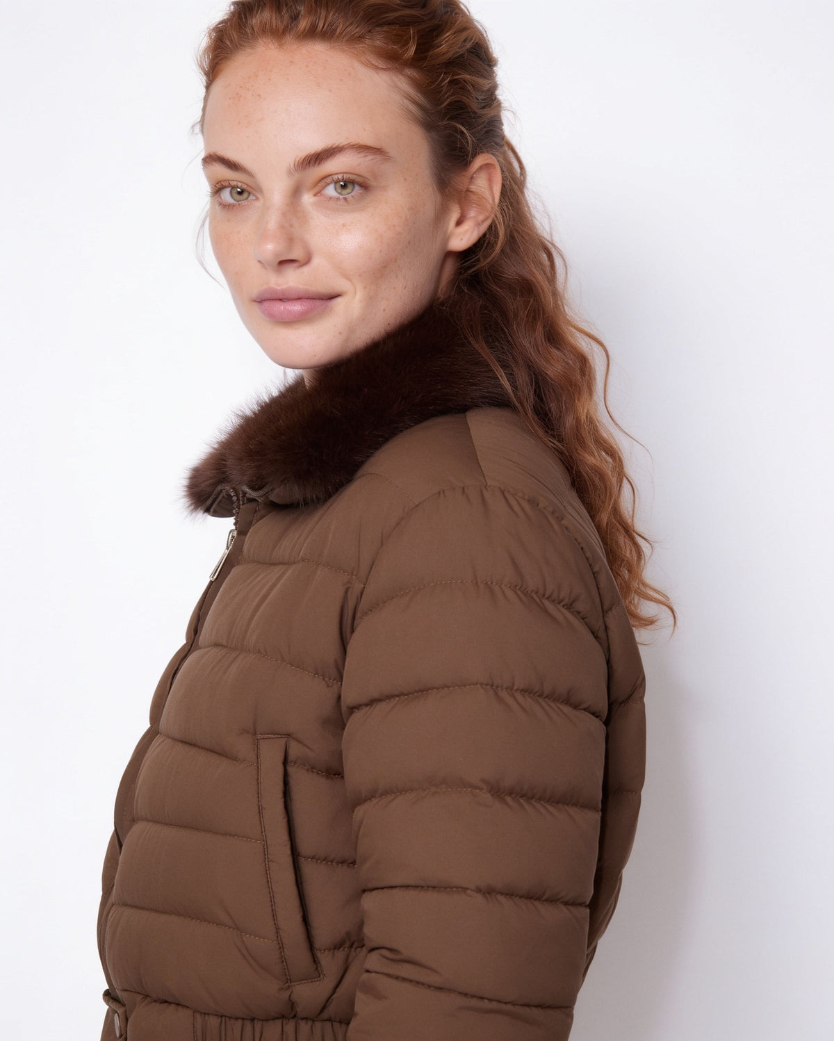 Brown cropped puffer jacket with faux fur collar and quilted sleeves, front zipper