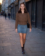 Brown cropped puffer jacket with faux fur collar and front zipper, fitted waist
