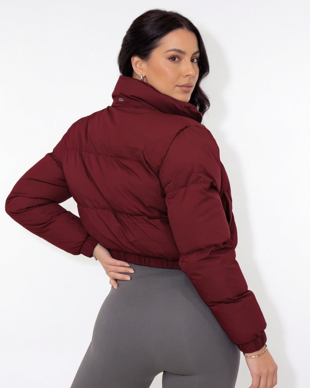 Burgundy cropped puffer jacket with funnel collar and zip front, long sleeves
