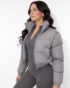 Cropped funnel-collar puffer jacket in light grey, zip-front, quilted chest pocket detail