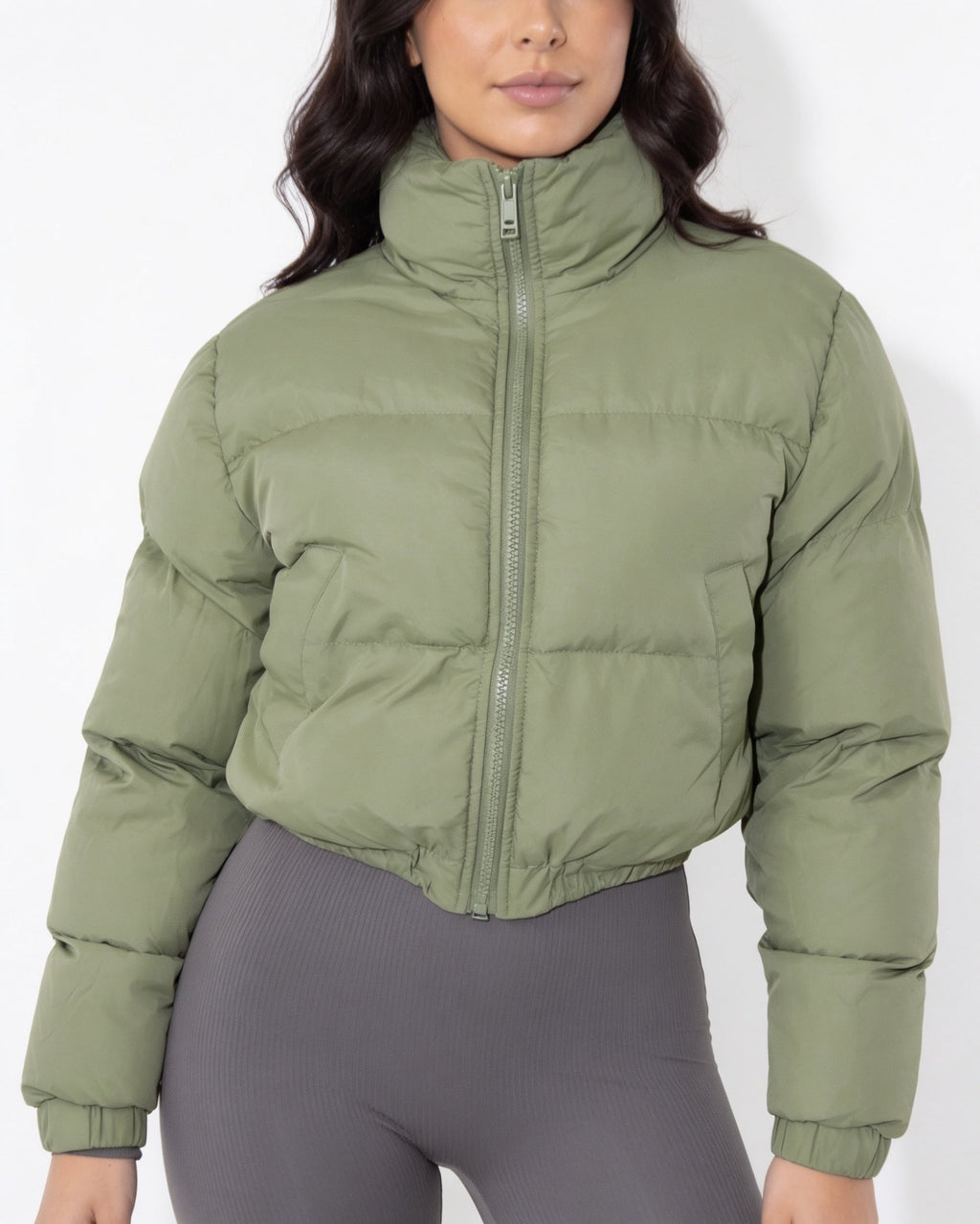 Army green cropped puffer jacket with funnel collar and zip front, quilted body