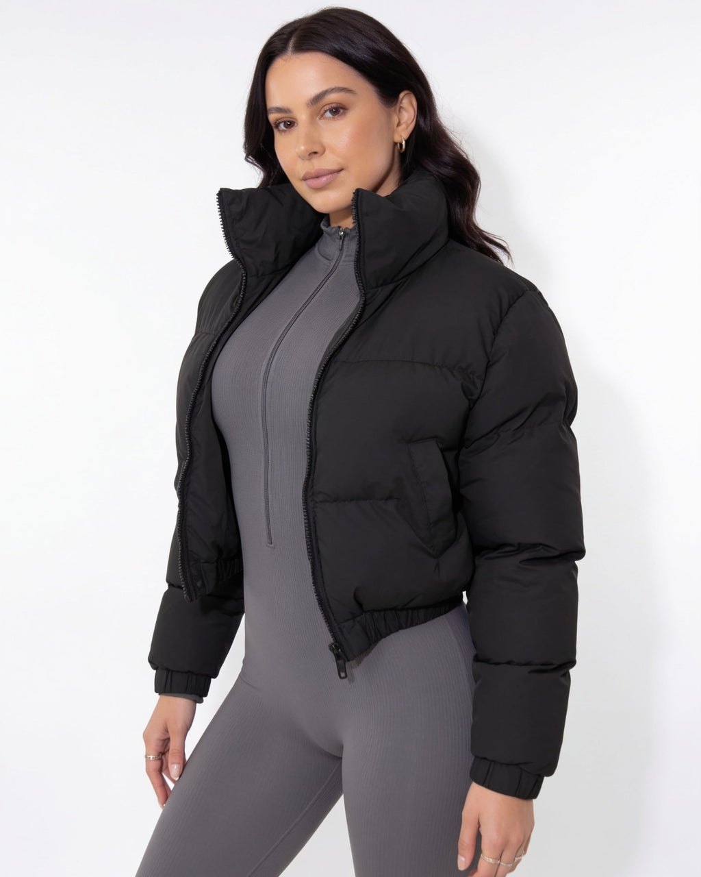 Black cropped puffer jacket with funnel collar and zip front, long sleeves
