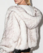 Off-white faux fur hooded jacket close-up, hood drape and soft fur texture.