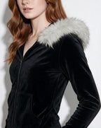 Black velvet hooded jacket close-up with light faux fur trim and zipper