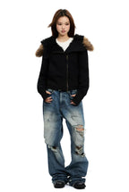 Black zip-up hoodie with black faux fur hood trim and tan fur shoulder panels