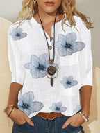 Women’s white blouse with blue floral pattern and front buttons, 3/4 sleeves