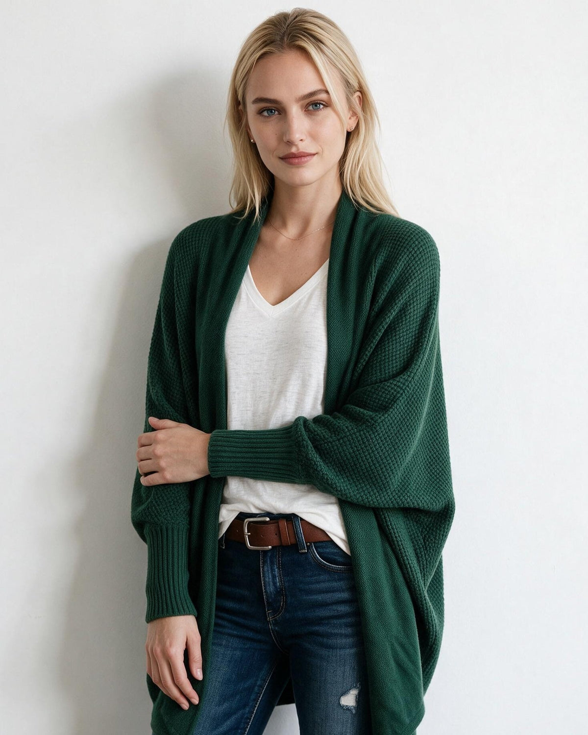 Women’s longline open-front cardigan with dolman sleeves, forest green textured knit.