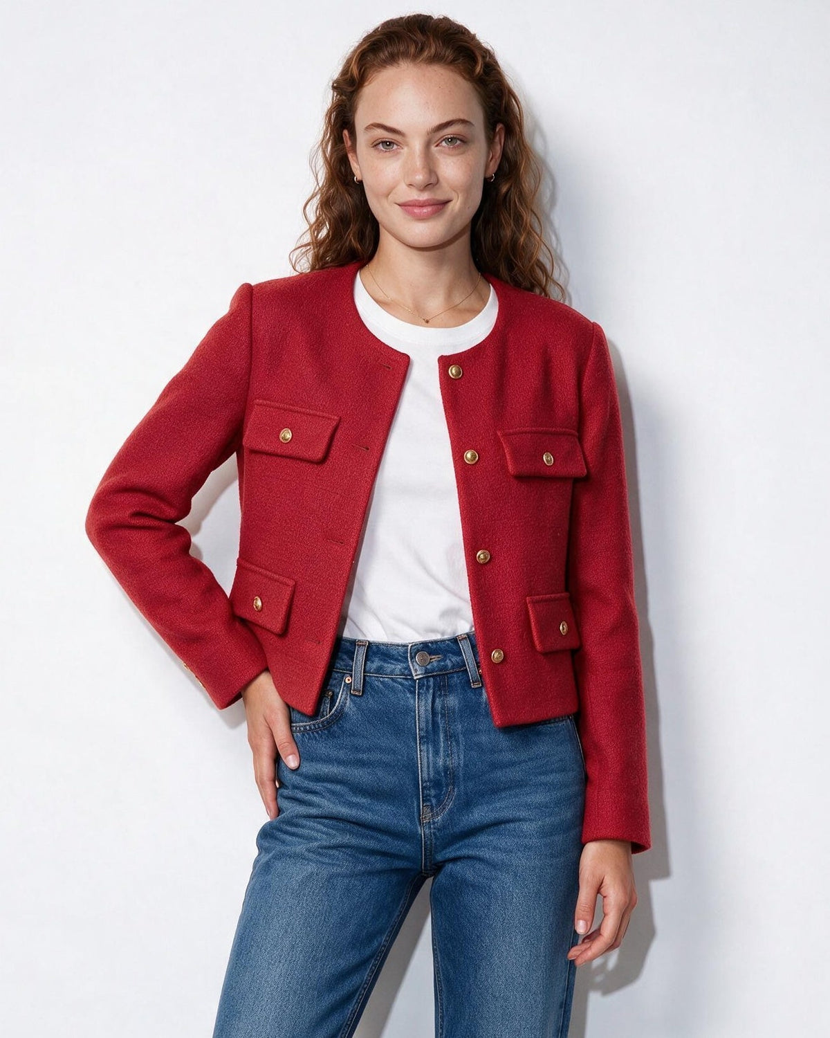 Red cropped collarless jacket with four flap pockets and gold button accents