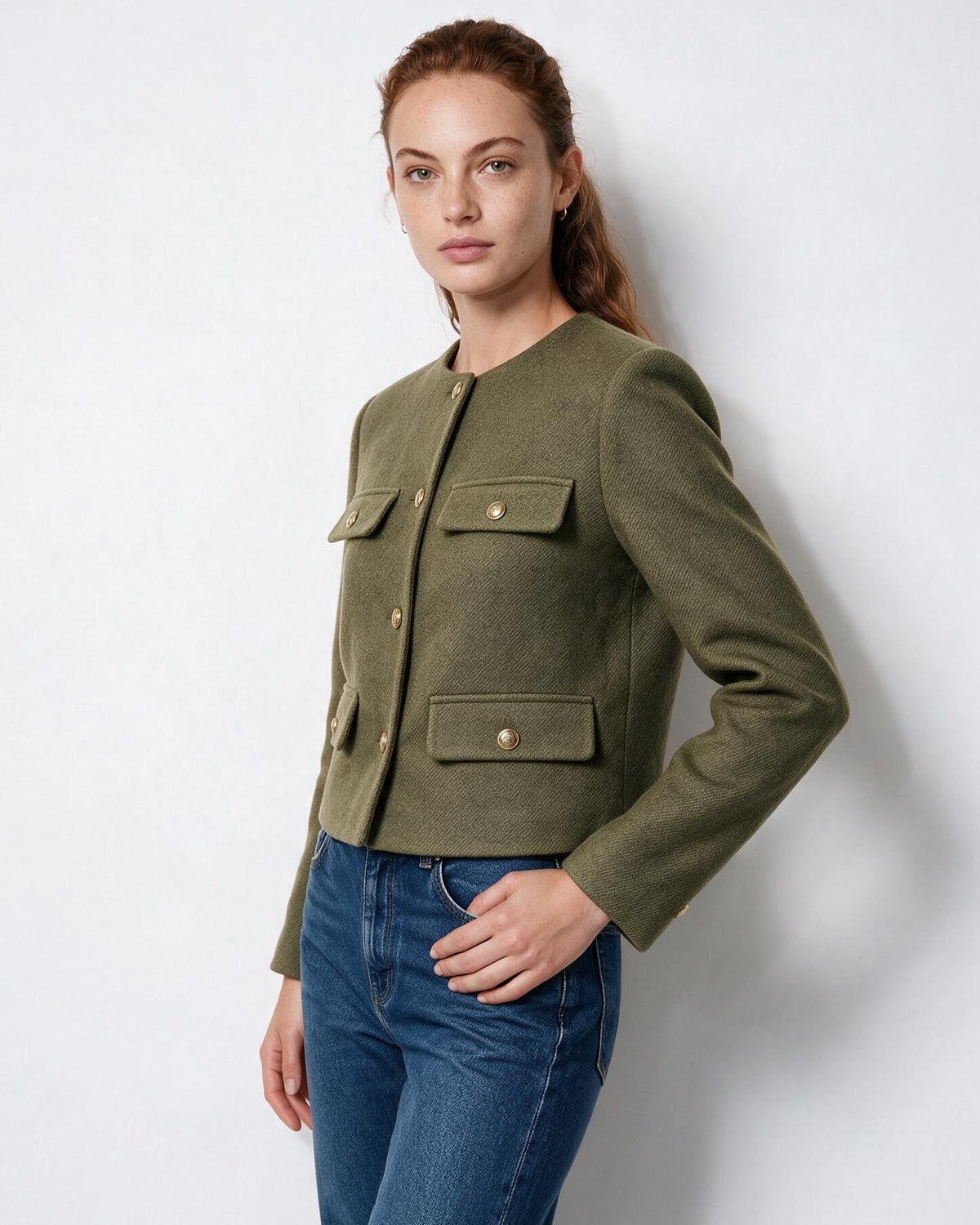 Cropped collarless jacket in olive green with gold buttons and four flap pockets