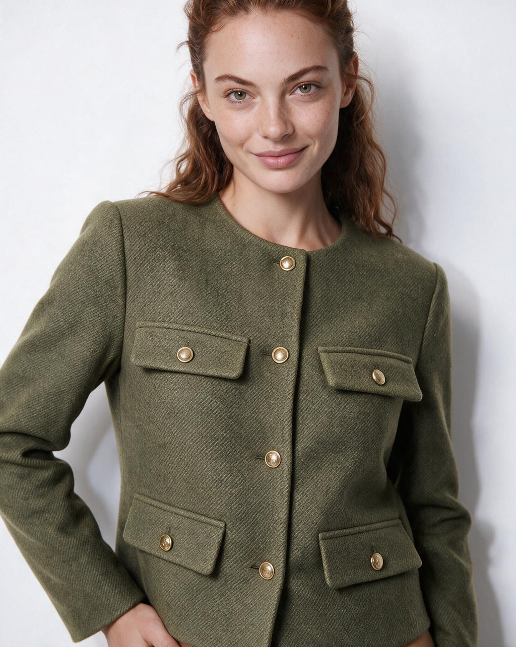 Cropped collarless jacket in olive green with gold buttons and four flap pockets
