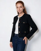 Cropped collarless jacket in black with gold buttons and four flap pockets