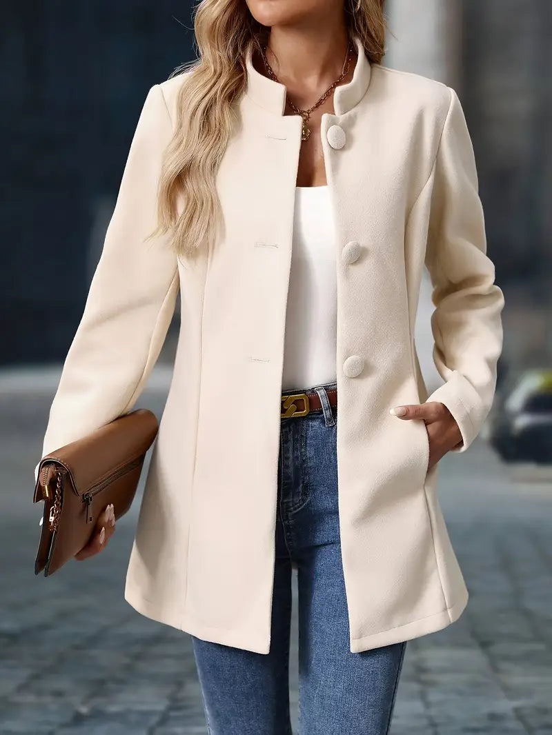 Women’s mid-length winter coat, cream, front view with stand collar buttons