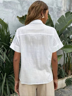 White short-sleeve cotton button-up shirt, back view