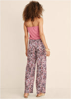 Back view strapless pink jumpsuit with abstract floral wide-leg legs