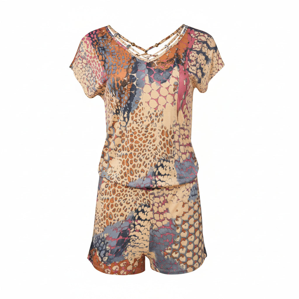 V-neck romper with abstract orange multi pattern, short sleeves and shorts