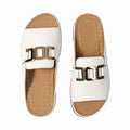 Women’s white wedge comfort sandals with metallic square buckle straps and open toe.