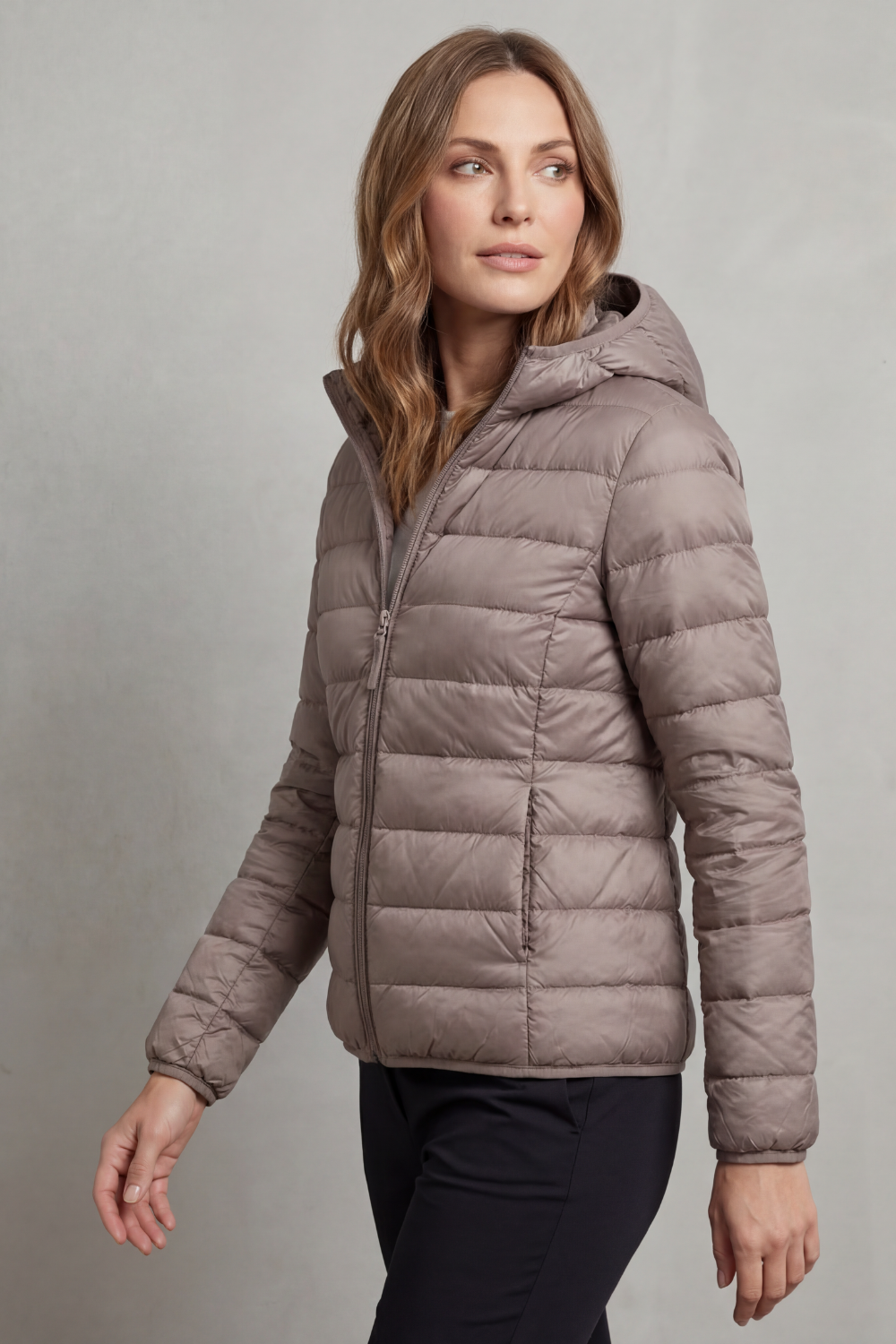 Women’s hooded puffer jacket in light grey, full-zip front and quilted insulation.