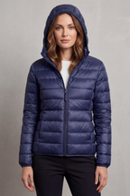 Women’s hooded puffer jacket in dark blue, full-zip front and quilted insulation.