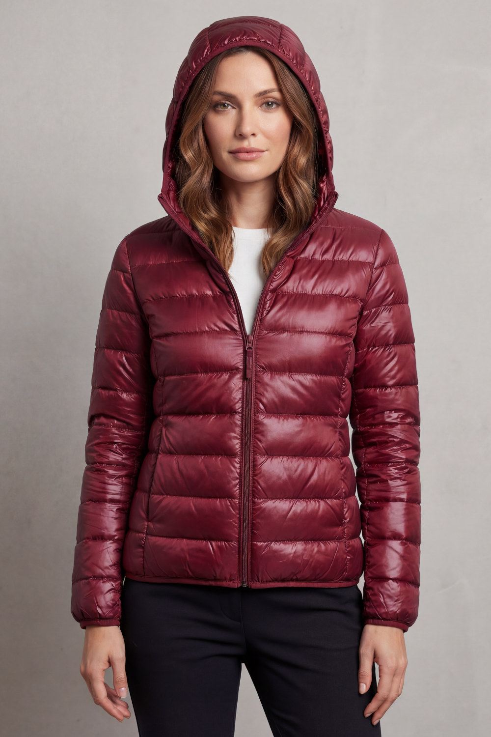 Women’s hooded puffer jacket in wine red, full-zip front and quilted insulation.