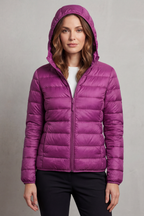 Women’s hooded puffer jacket in purple, full-zip front and quilted insulation.