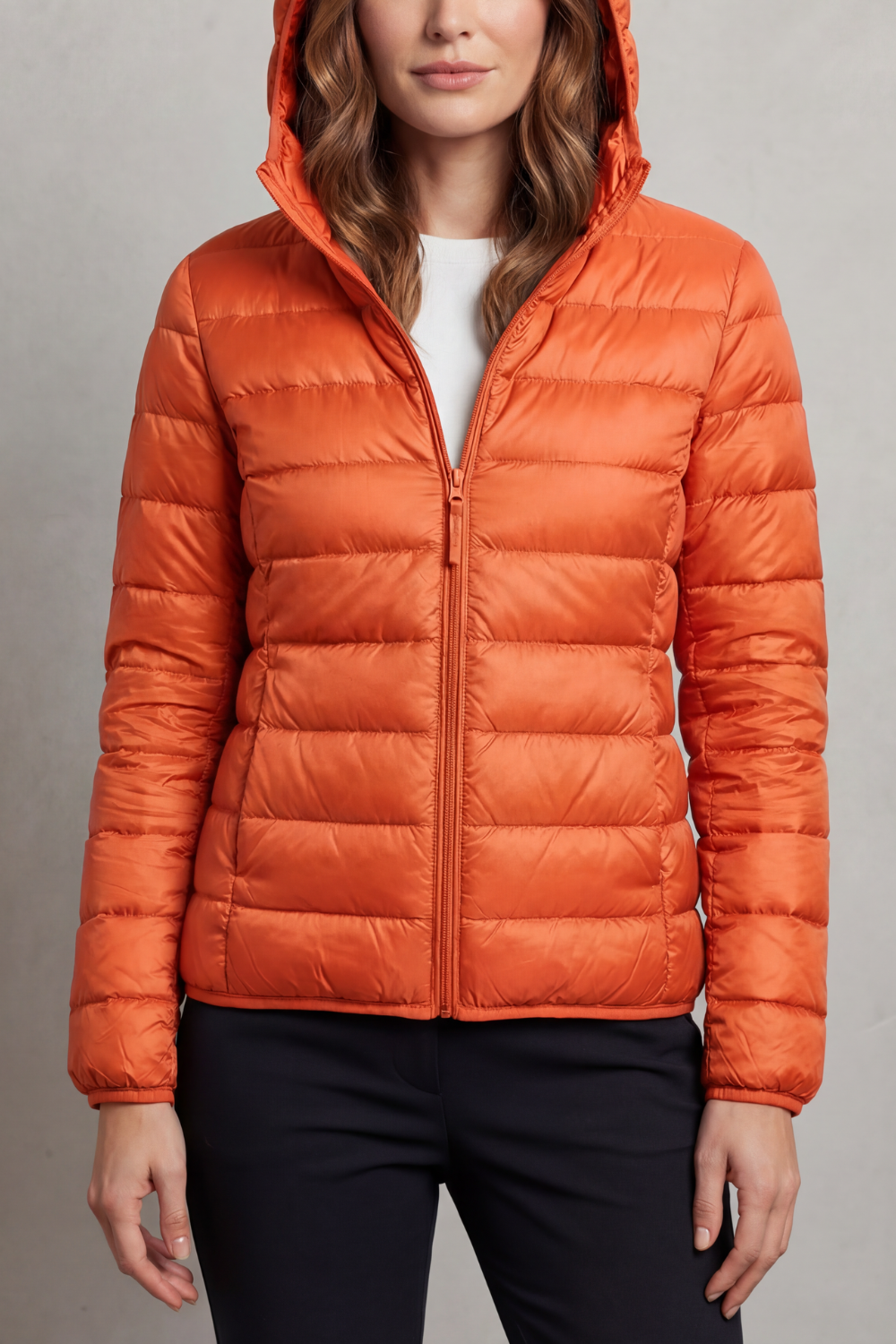 Women’s hooded puffer jacket in orange, full-zip with elastic cuffs