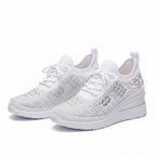 White knit orthopedic sneakers with lace-up front and thick white cushioned sole