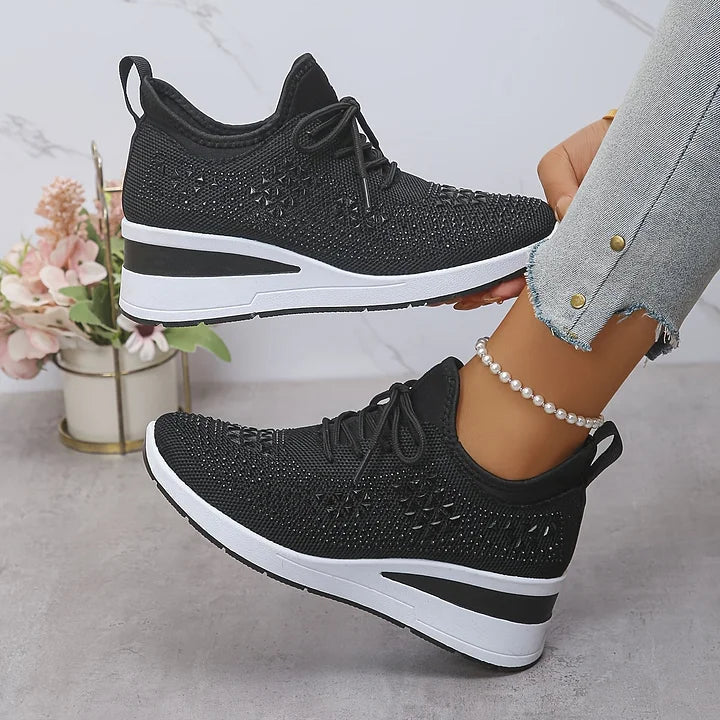 Black knit orthopedic sneakers with lace-up front and white cushioned sole