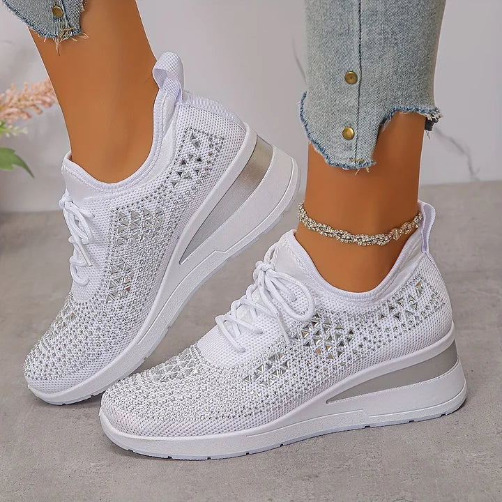 White knit orthopedic sneakers with lace-up front and thick white cushioned sole