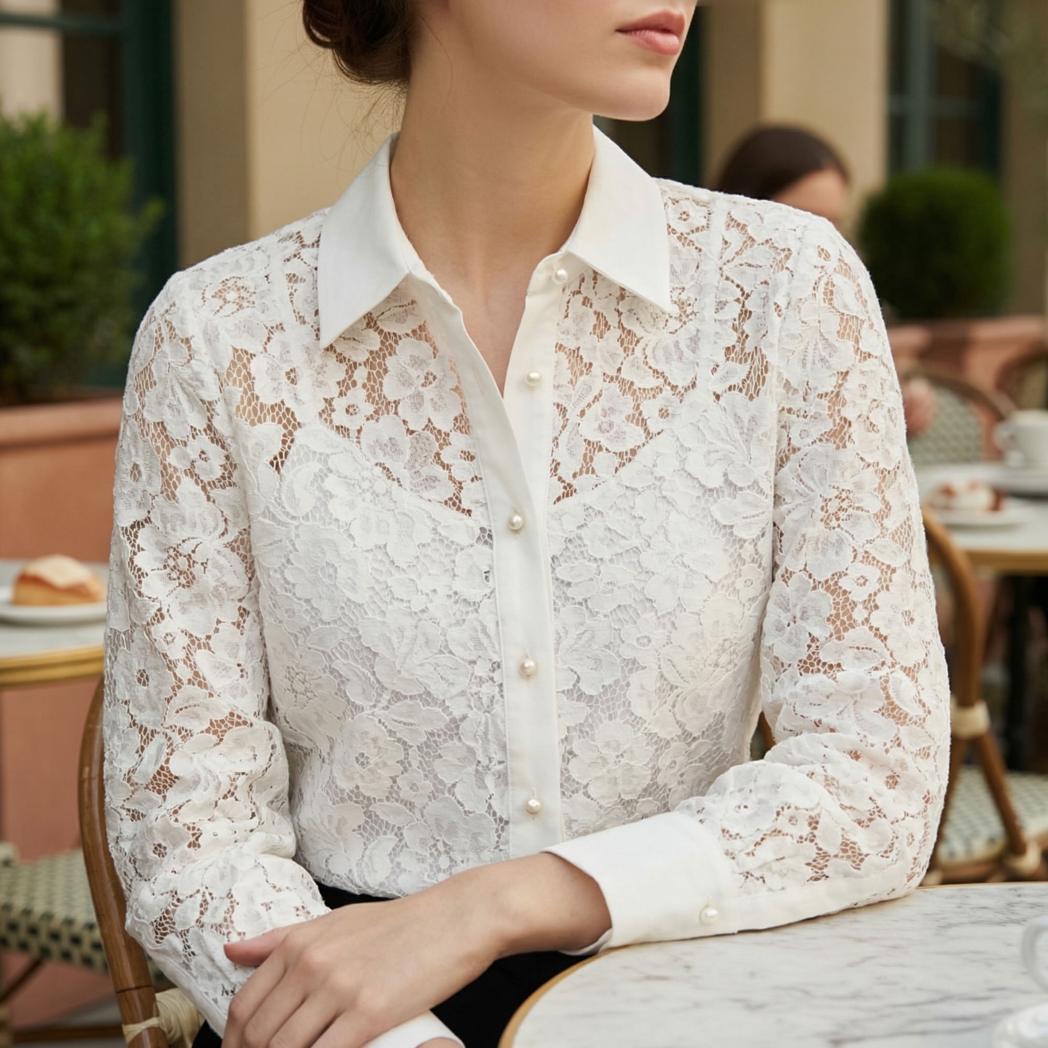 White lace button-up blouse with pointed collar, front buttons, and long sleeves