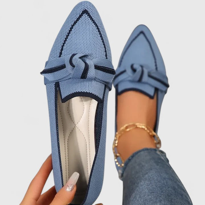 Women’s ribbon comfort sandals in light blue with dark trim, lace-up bow strap.