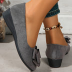 Gray suede ballerina flats with bow accent and low wedge heel