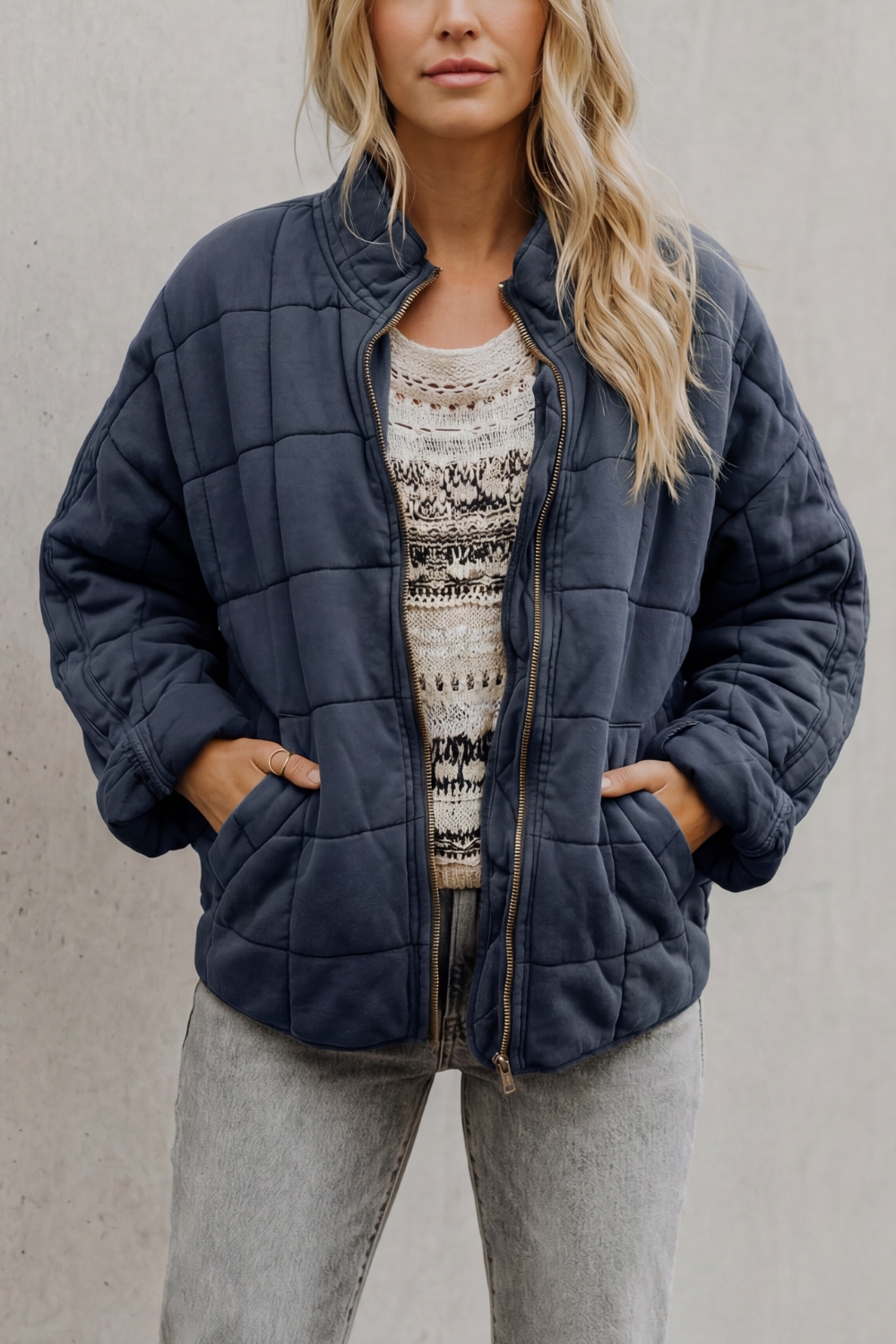Quilted women’s zip-up jacket in dark navy, stand collar, long sleeves, front pockets
