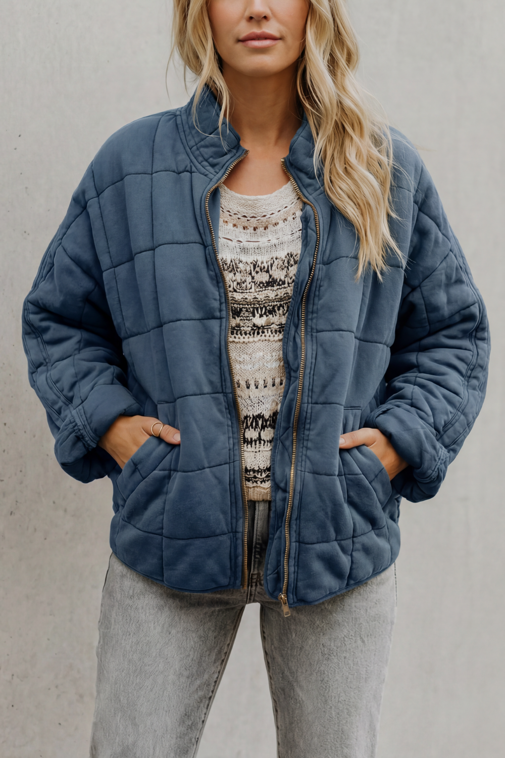 Quilted women’s zip-up jacket in steel blue, stand collar, long sleeves, front pockets
