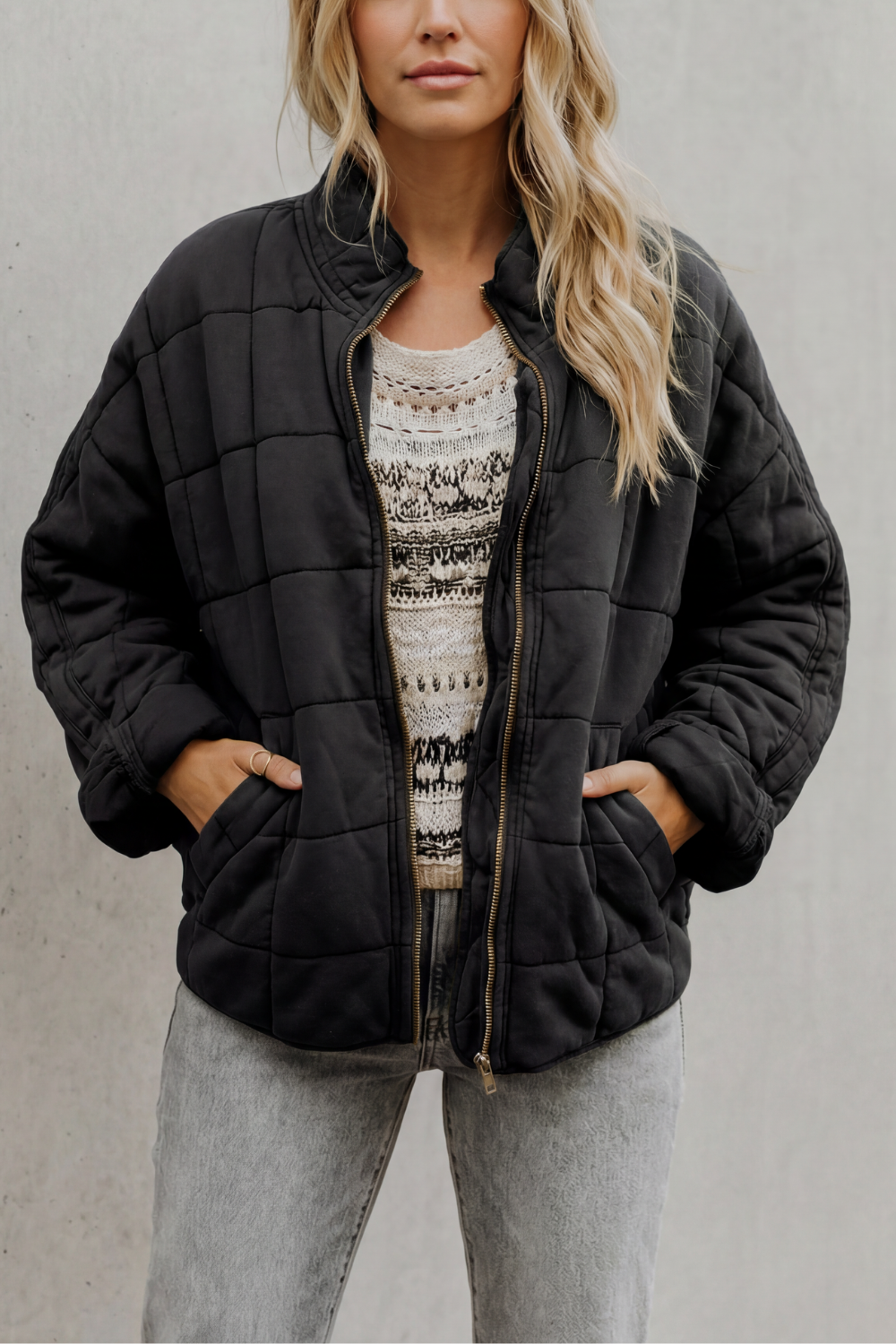 Quilted women’s zip-up jacket in black, stand collar, long sleeves, front pockets