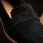 Aurelia black suede loafers close-up of strap and stitched seam