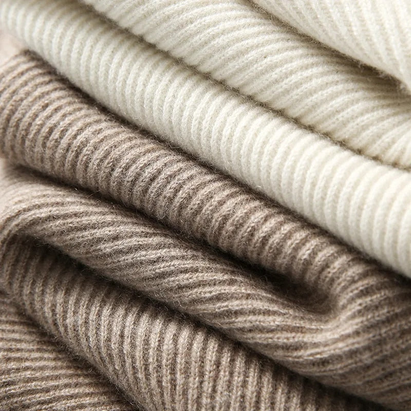 Ribbed knit layers of a women’s hoodie in cream and taupe tones